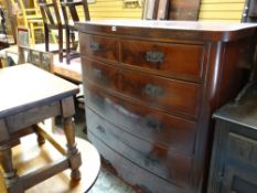 An antique mahogany bow fronted chest of three long and two short drawers