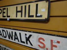 A street sign for Broadwalk SE3 and Chapel Hill