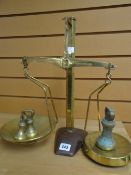 A vintage set of W & T Avery limited brass scales on a loaded base with weights