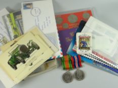 A parcel of first day covers, coin sets and two military medals
