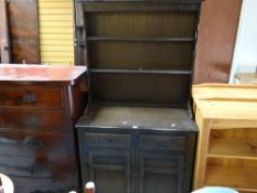 A carved stained dresser and a pair of pine open bookcases