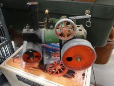 A boxed Mamod steam tractor
