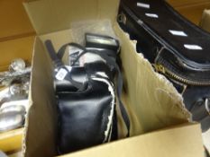 Mid-century Pentax MV camera together with a 1980s Minolta SLR camera and flash gun