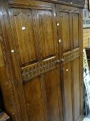 A good vintage linen-fold double wardrobe with matching dressing table