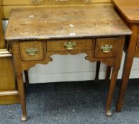 An antique nineteenth century oak low boy having three drawers with brass handles and on cabriole