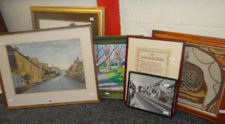 A parcel of framed pictures including pastel drawing of an English village, a tapestry of a cat on a