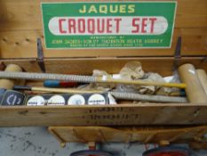 A boxed Jaques of London croquet set together with a child's wooden cart