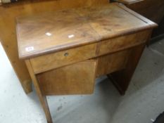 A vintage table with lift up compartmented interior and cupboard base, 72cms wide