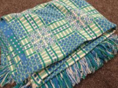 A blue & green geometric patterned Welsh blanket
