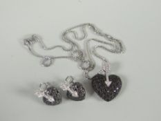 A modern 18ct white gold set of matching necklace, heart pendant and heart clip earrings, 16gms