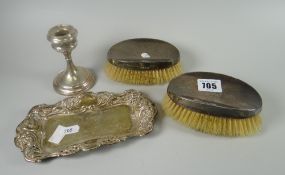 Pair of silver backed clothes brushes, pierced silver dish with centred monogram and a loaded silver