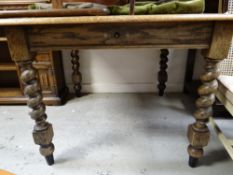 A vintage barley-twist oak winding extending dining table, 104cms wide