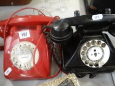 Two vintage two-piece telephones in red and black