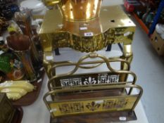 A brass twin-handled footman together with a copper and brass kettle and small brass and wood
