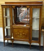A good Edwardian mahogany inlaid display cabinet having flanking curved full-length glass cabinets
