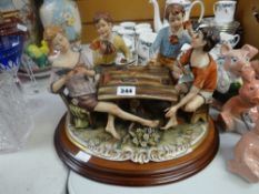 A Capodimonte pottery sculpture of four card playing youths