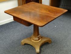 An antique mahogany foldover tea table on a shaped columnal base, 85cms wide