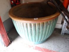 A large green glazed garden planter, 46cms high