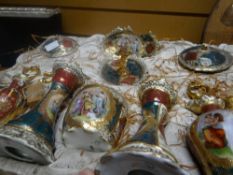 A Vienna porcelain dressing table set, typically decorated with vignettes and alternating coloured