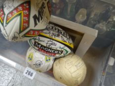 Two modern professional era signed rugby balls, a Leeds United commemorative football, a signed