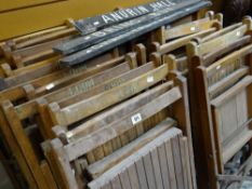 A good set of 24 vintage folding slatted chairs from a community hall together with three painted