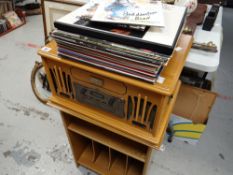 A Classic Collection Edition retro compact disk player and a small parcel of vinyl records including