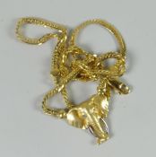A modern 9ct yellow gold herringbone necklace attached to believed 9ct yellow gold elephant head