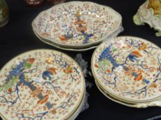 A 10-piece antique Derby pot dinner service decorated in the Imari palette with exotic foliage and