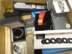 A large quantity of loose and cased ladies fashion watches