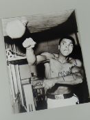 Signed Muhammad Ali boxing black and white photograph with certificate of authenticity