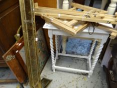 Painted white barley-twist side table, two painters easels, fire screens and brass fender