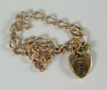 A modern 9ct yellow gold link bracelet and heart-shaped padlock, 7.5gms Please note: weights and