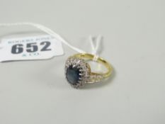 18ct gold flowerhead diamond and sapphire ring, 4.4 grams Please note: not tested, hallmarks,