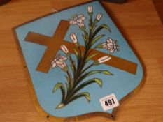 A nineteenth century brass enamelled shield / plaque (possibly religious) decorated with enamelled