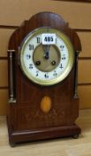 A good Edwardian inlay and box-string mahogany architectural mantel clock having brass pillars and