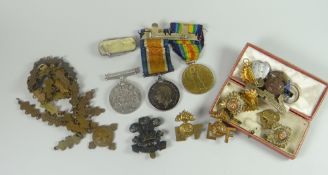 A bar of two 1914-1918 / 1914-1919 WWI campaign medals inscribed 242559 SJT.F.W.Thackwell Lan.