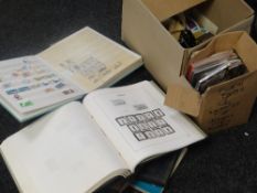 A tub of loose and stamps in albums together with first day covers and presentation packs