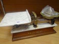 A set of W & T Avery scales having a ceramic dish on a marble mounted wooden stand with stencilled W
