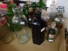 A collection of green and clear glass vintage pharmacy bottles ETC