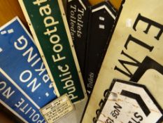 A group of mixed metal street and other signs