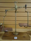 A set of Day & Millward brass and copper scales on wooden base