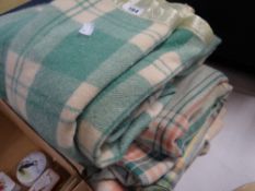 Three mainly green and cream check Welsh woollen blankets