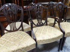 A set of six antique mahogany dining chairs (5+1) with matching floral upholstered seats
