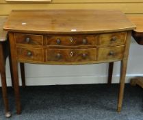 An antique inlaid mahogany compact bow front sideboard with bottom long drawer and three upper