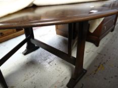 A good Ercol oval drop flap dining table