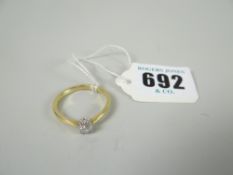 A yellow metal ring set with round cut diamond solitaire Please note: not tested, hallmarks, weights
