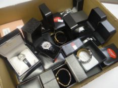 A large quantity of loose and cased ladies fashion watches