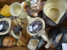 A collection of various Toby Jugs and decorative plaster heads