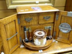 Early twentieth century oak smoker's cabinet with fitted interior including a Doulton Lambeth
