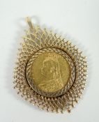 An 1892 gold half-sovereign within a 9ct yellow gold filigree mount, 8.5gms total Please note: